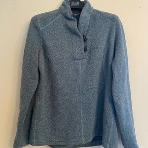 North face healthered blue 3/4 pullover. Warm and cute!